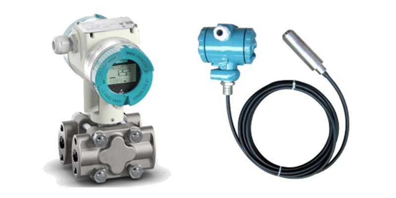 Calibration Services: Two industrial pressure transmitters, one with a digital display, for pressure measurement and calibration.